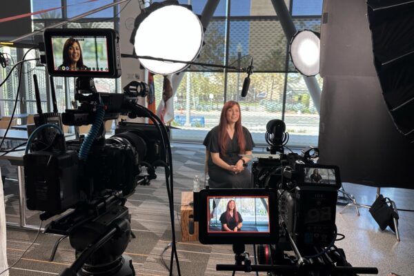 Close-up monitor shot of employee being interviewed