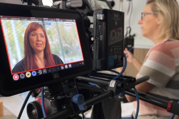 Camera capturing interview footage of OC Health Care Agency employee