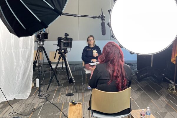 Behind-the-scenes of filming a seated employee interview