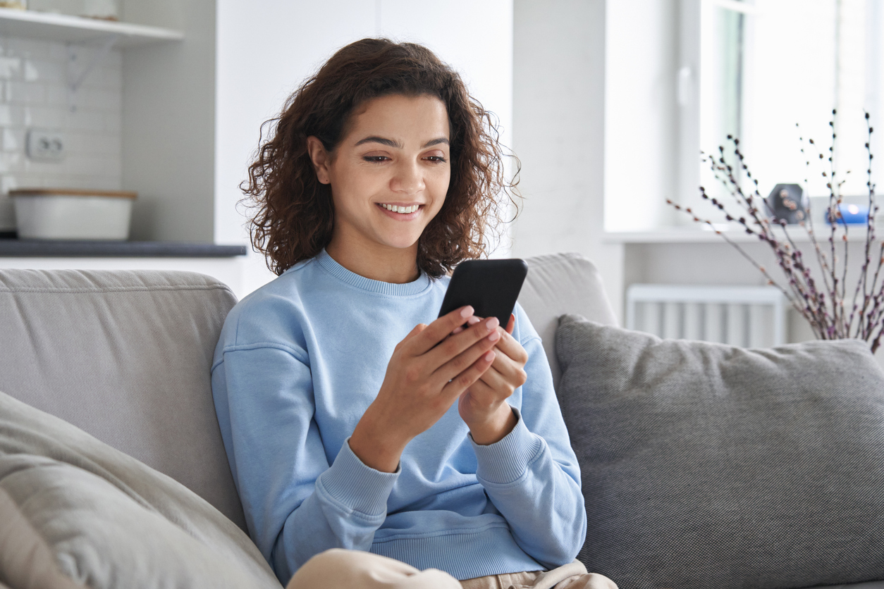 woman watching educational video on phone